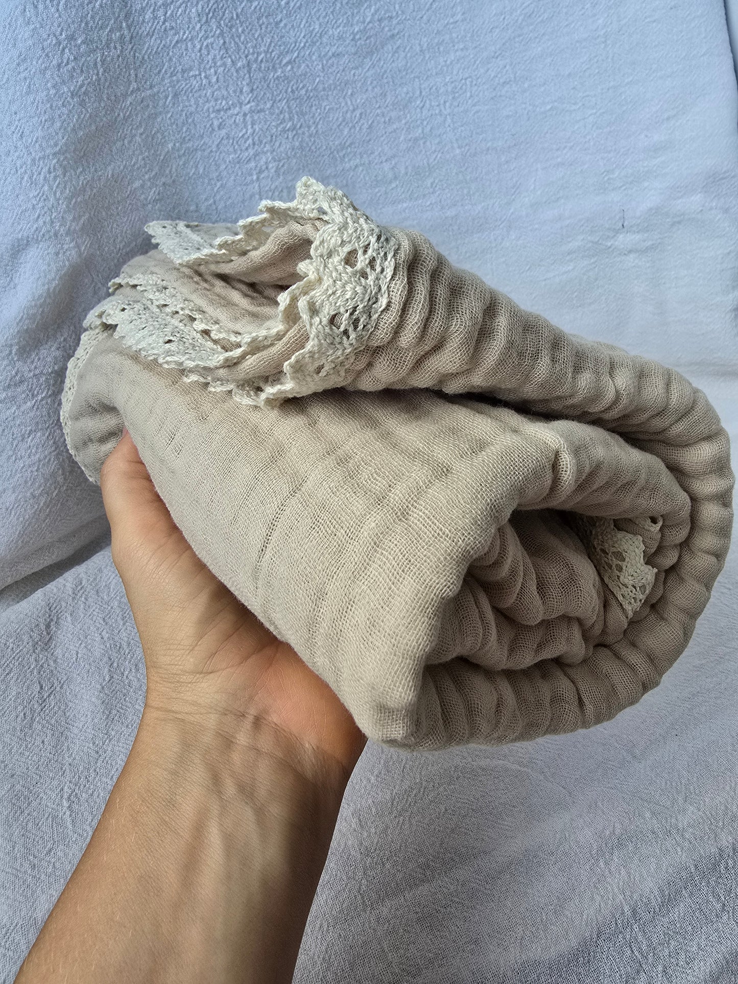 Cotton muslin blanket in sand