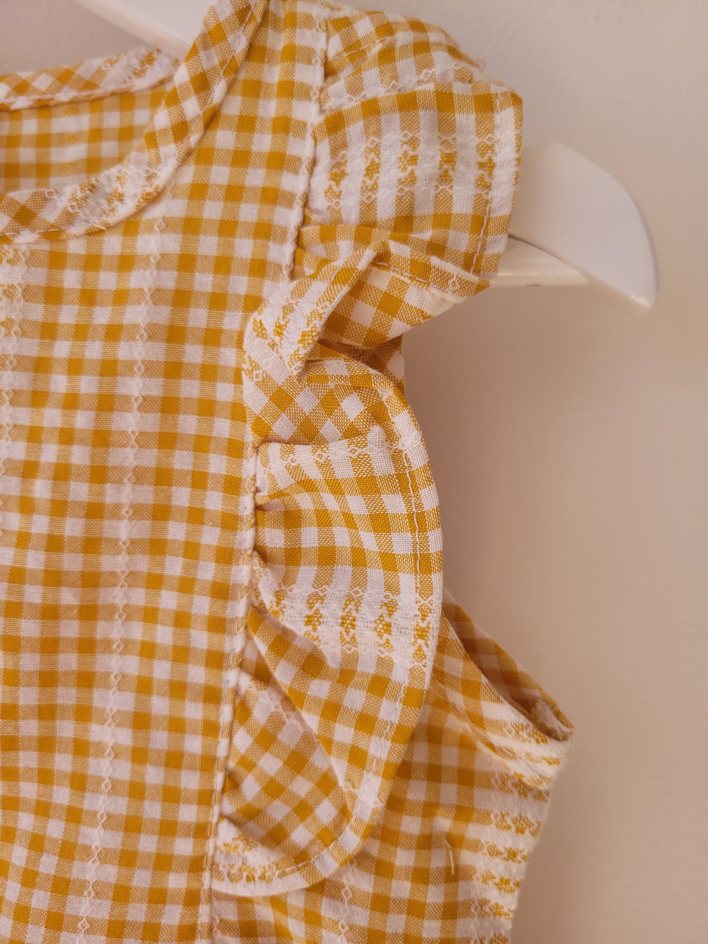 Ruffled sleeveless gingham dress in ginger