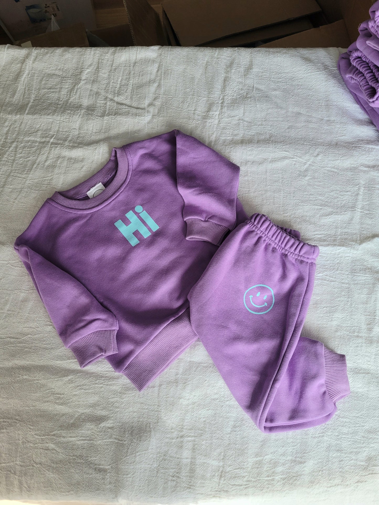 "Hi" set in purple